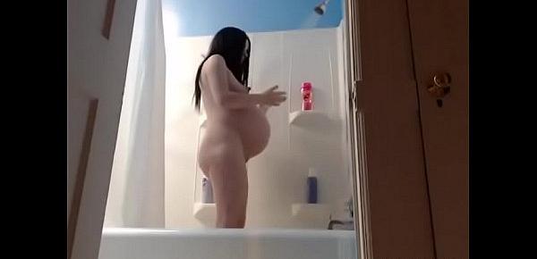  Hot pregnant girl taking shower on webcam